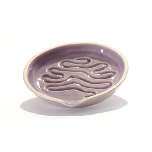 Millie is a ceramic grinder tray that grinds weed and funnels cannabis into a pipe bowl, this smoke accessory is handmade by a woman-owned studio in the USA. Millie in purple lavender is a ceramic grinder that grinds cannabis, easily funnels weed into a pipe or bong bowl, easy to clean and keeps your hands mess free. 