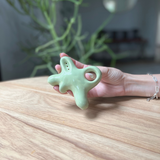 A ceramic abstract pipe that smokes like a dream and complements interior design; this dry pipe is handmade by a woman-owned studio in the USA. Nebula is a green ceramic pipe that doubles as art in your home and pairs well with your favorite smoke accessories. Smoke your favorite bud from this ceramic hand pipe in Moss.