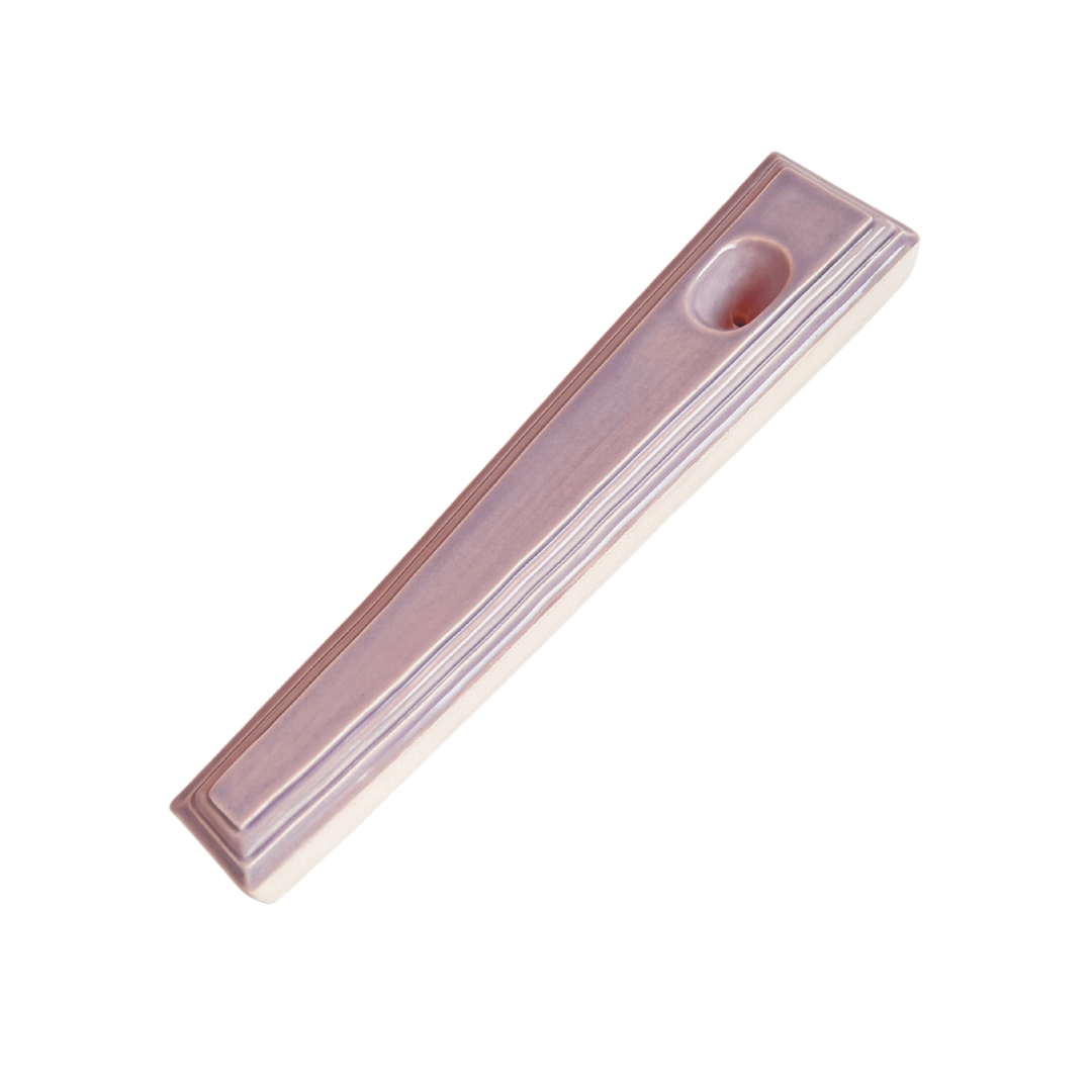 A ceramic steamroller that smokes like a dream and complements interior design; this dry pipe is handmade by a woman-owned studio in Kansas City, MO. Nelle is a purple ceramic pipe that doubles as art in your home and pairs well with your favorite smoke accessories. Smoke your favorite bud from this ceramic hand pipe in Lilac.