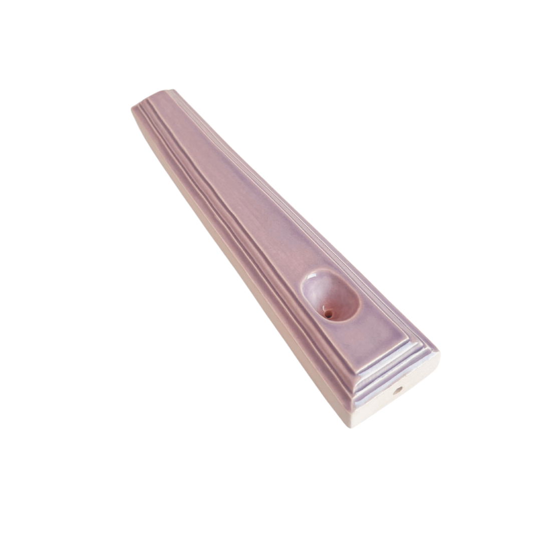 A ceramic steamroller that smokes like a dream and complements interior design; this dry pipe is handmade by a woman-owned studio in Kansas City, MO. Nelle is a purple ceramic pipe that doubles as art in your home and pairs well with your favorite smoke accessories. Smoke your favorite bud from this ceramic hand pipe in Lilac.