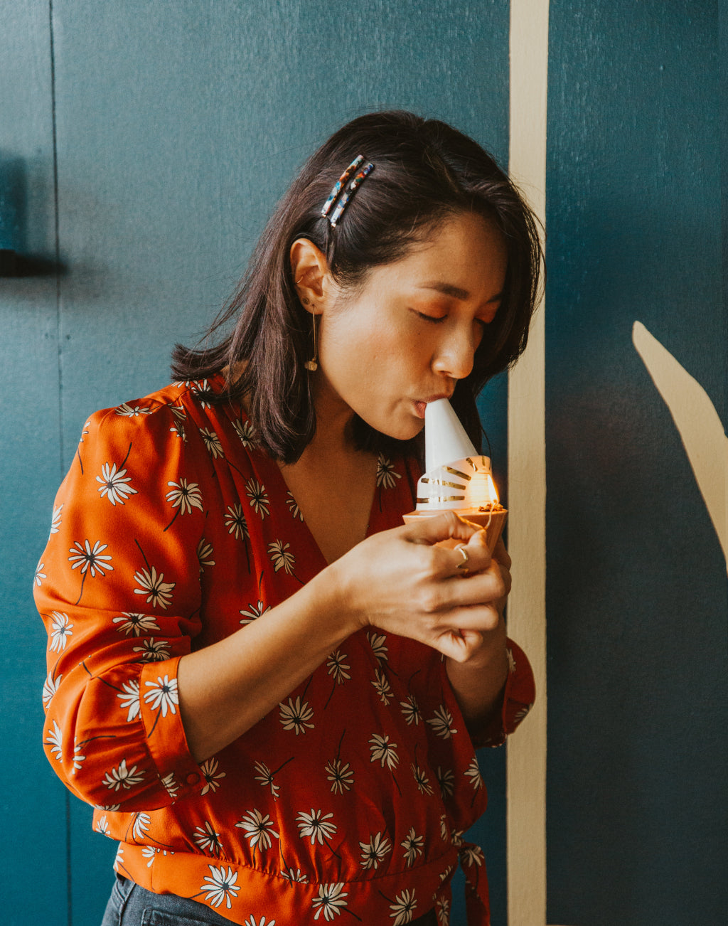 Person enjoying the Billie ceramic bubbler by Wandering Bud with a hemp wick