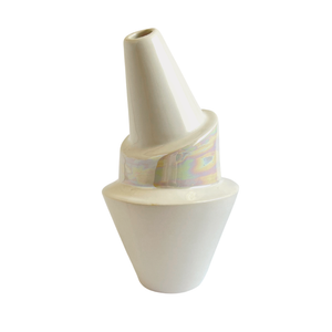 A ceramic bubbler that smokes like a dream and complements interior design; this water pipe, or mini bong, is handmade by a woman-owned studio in Kansas City, MO. Billie is an iridescent ceramic water pipe that doubles as art in your home and pairs well with your favorite smoke accessories. Smoke your favorite bud from this ceramic bubbler in Pearl.