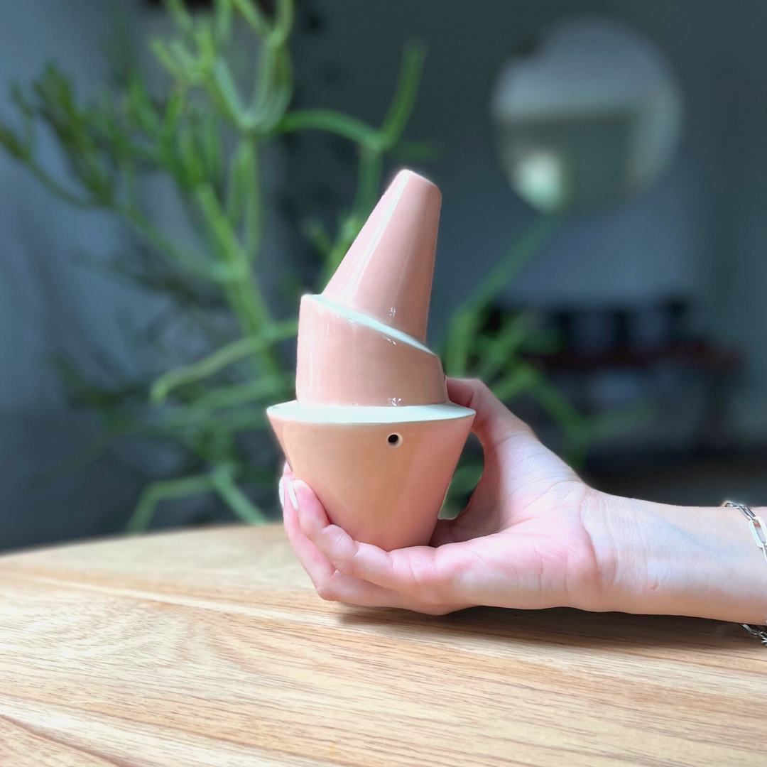 A ceramic bubbler that smokes like a dream and complements interior design; this water pipe, or mini bong, is handmade by a woman-owned studio in the US. Billie is a pink-beige ceramic water pipe that doubles as art in your home and pairs well with your favorite smoke accessories. Smoke your favorite bud from this ceramic bong in Canyon.