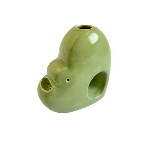 A ceramic bubbler that smokes like a dream and complements interior design; this water pipe, or mini bong, is handmade by a woman-owned studio in Missouri, USA. Blossom is a green ceramic bubbler that doubles as art in your home and pairs well with your favorite smoke accessories. Smoke your favorite bud from this ceramic bong in Moss.