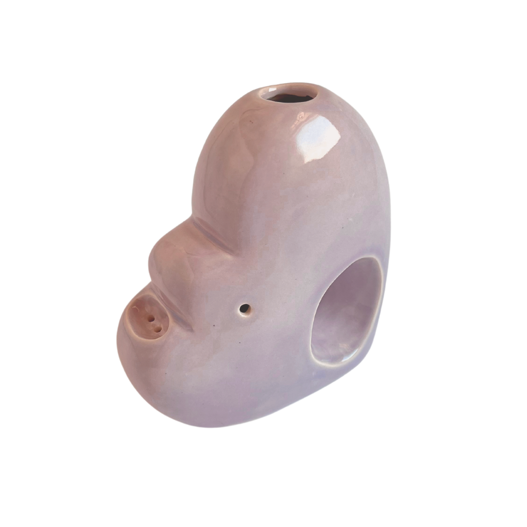 A ceramic bubbler that smokes like a dream and complements interior design; this water pipe, or mini bong, is handmade by a woman-owned studio in the US. Blossom is a purple ceramic bubbler that doubles as art in your home and pairs well with your favorite smoke accessories. Smoke your favorite bud from this ceramic bong in Lilac.