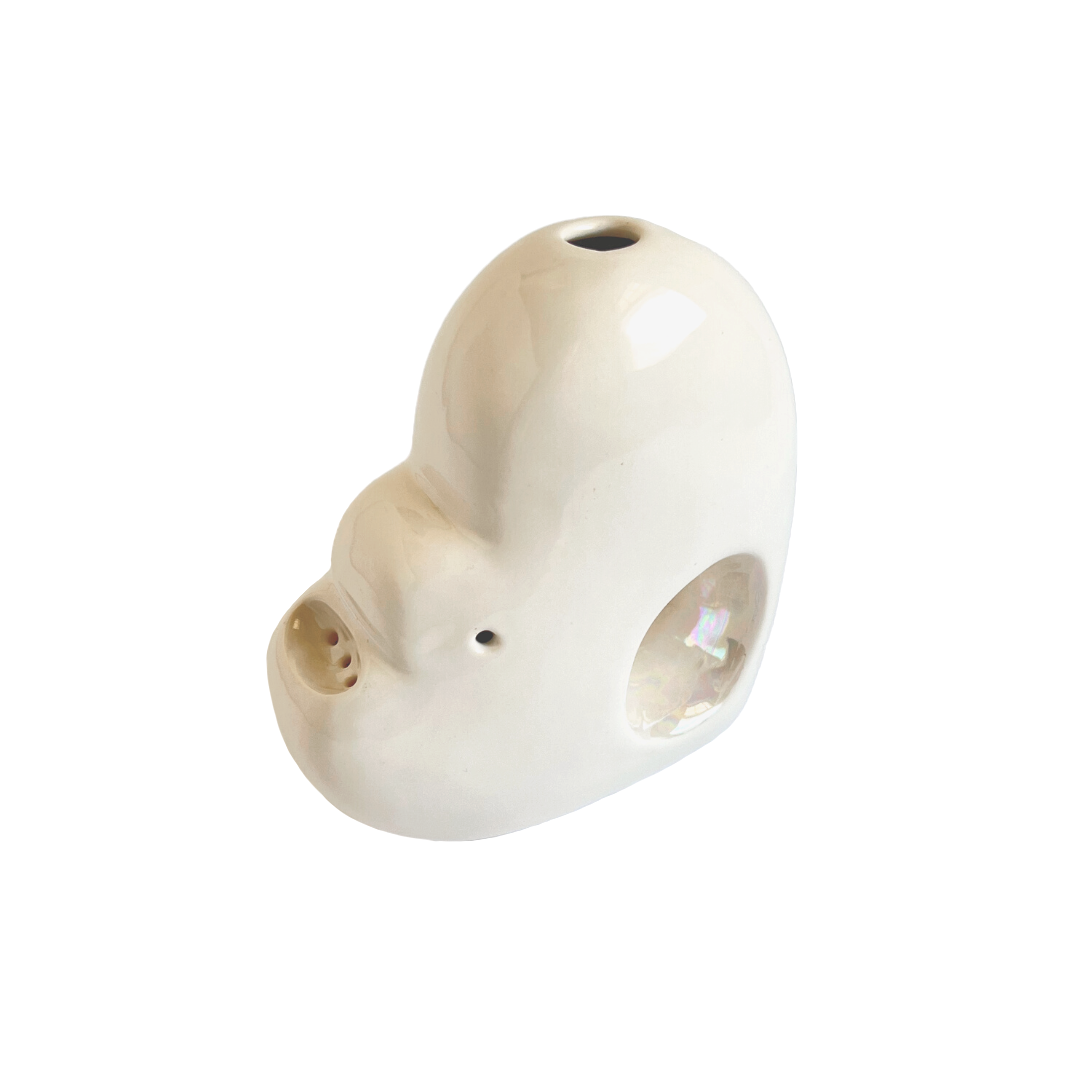 A ceramic bubbler that smokes like a dream and complements interior design; this water pipe, or mini bong, is handmade by a woman-owned studio in the USA. Blossom is a white and iridescent ceramic bubbler that doubles as art in your home and pairs well with your favorite smoke accessories. Smoke your favorite bud from this ceramic bong in Pearl.