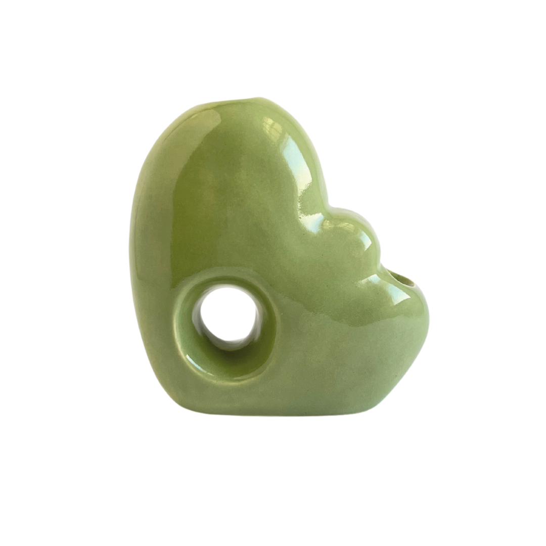 A ceramic bubbler that smokes like a dream and complements interior design; this water pipe, or mini bong, is handmade by a woman-owned studio in Missouri, USA. Blossom is a green ceramic bubbler that doubles as art in your home and pairs well with your favorite smoke accessories. Smoke your favorite bud from this ceramic bong in Moss.
