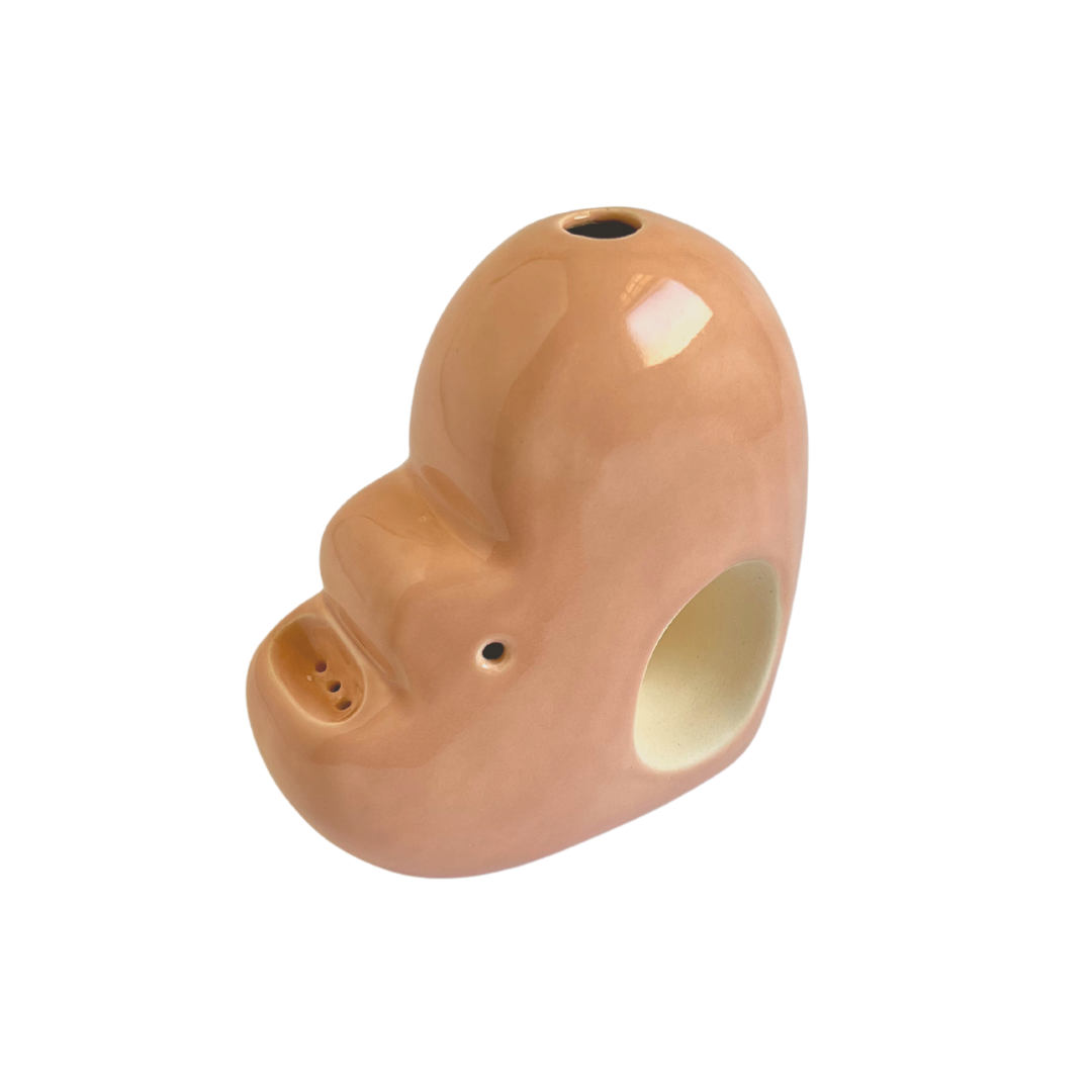 A ceramic bubbler that smokes like a dream and complements interior design; this water pipe, or mini bong, is handmade by a woman-owned studio in United States. Blossom is a pink-beige ceramic bubbler that doubles as art in your home and pairs well with your favorite smoke accessories. Smoke your favorite bud from this ceramic bong in Canyon.