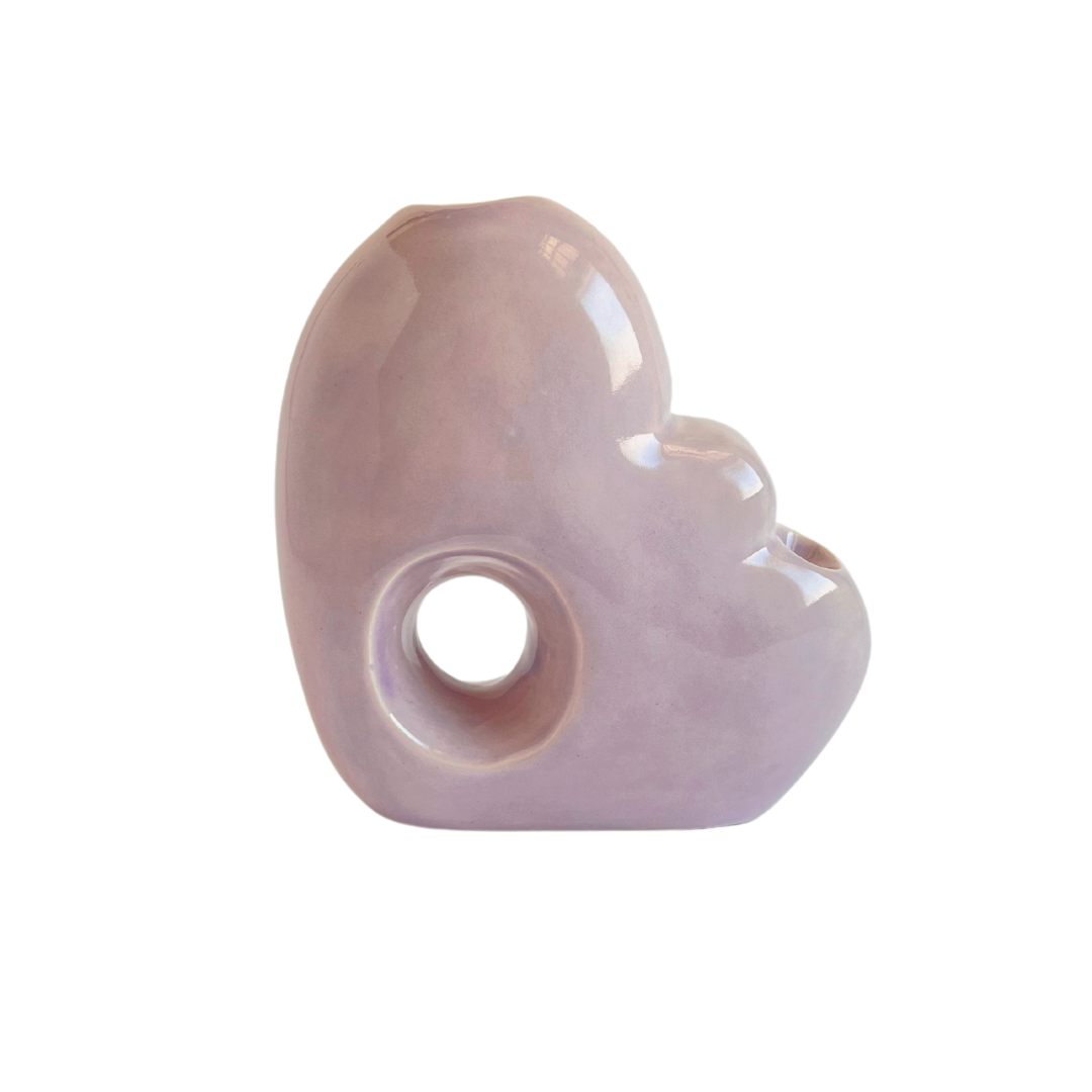 A ceramic bubbler that smokes like a dream and complements interior design; this water pipe, or mini bong, is handmade by a woman-owned studio in the US. Blossom is a purple ceramic bubbler that doubles as art in your home and pairs well with your favorite smoke accessories. Smoke your favorite bud from this ceramic bong in Lilac.