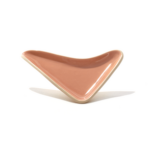 Our boomerang tray provides the perfect surface to pour out a cannabis grinder, and the built-in spout funnels weed into the pipe bowl, mess-free. Our ceramic smoke trays and accessories are handmade by a woman-owned studio in the USA. This beige pink weed tray doubles as art in your home and complements home decor.
