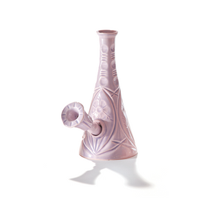 A ceramic bong that smokes like a dream and complements interior design; this water pipe is handmade by a woman-owned studio in the USA. Flora is a purple ceramic water pipe that doubles as art in your home and pairs well with your favorite smoke accessories. Smoke your favorite bud from this ceramic bong in Lilac.