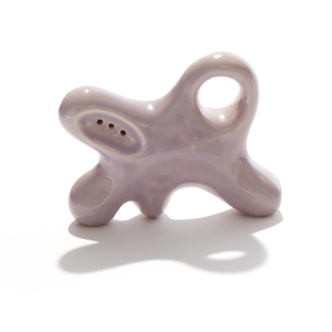 A ceramic abstract pipe that smokes like a dream and complements interior design; this dry pipe is handmade by a woman-owned studio in the United States. Nebula is a purple ceramic pipe that doubles as art in your home and pairs well with your favorite smoke accessories. Smoke your favorite bud from this ceramic hand pipe in Lilac.
