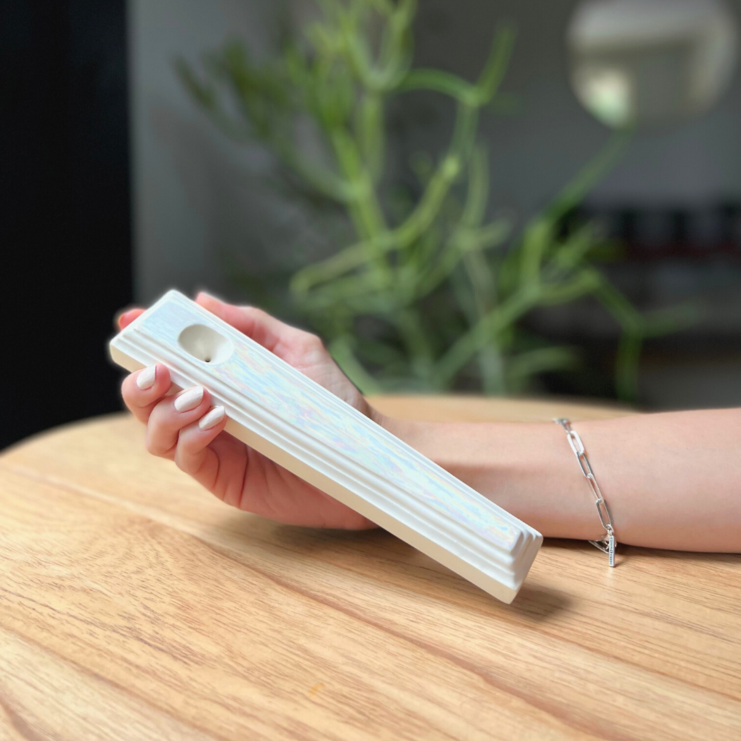A ceramic steamroller that smokes like a dream and complements interior design; this dry pipe is handmade by a woman-owned studio in the USA. Nelle is an iridescent ceramic pipe that doubles as art in your home and pairs well with your favorite smoke accessories. Smoke your favorite bud from this ceramic hand pipe in Pearl.