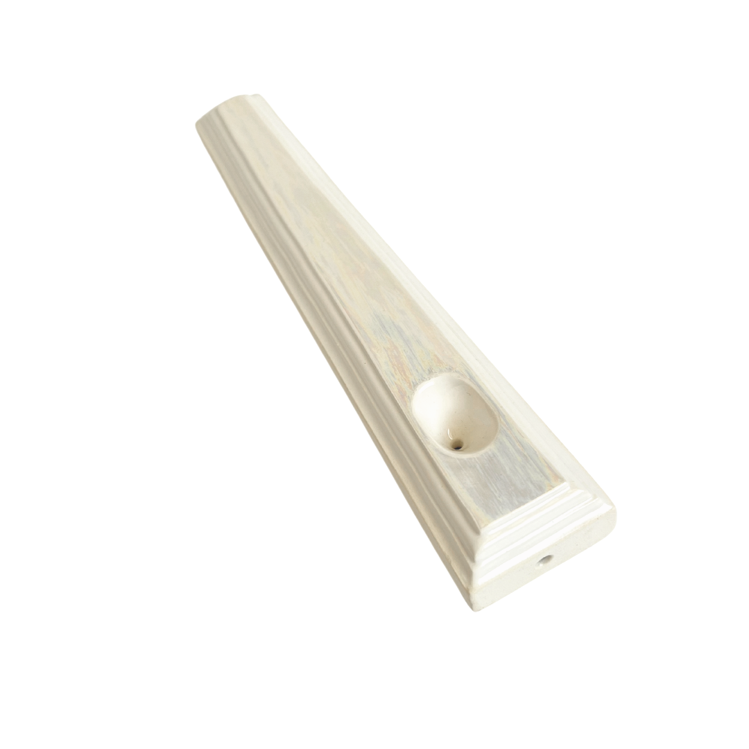 A ceramic steamroller that smokes like a dream and complements interior design; this dry pipe is handmade by a woman-owned studio in the USA. Nelle is an iridescent ceramic pipe that doubles as art in your home and pairs well with your favorite smoke accessories. Smoke your favorite bud from this ceramic hand pipe in Pearl.