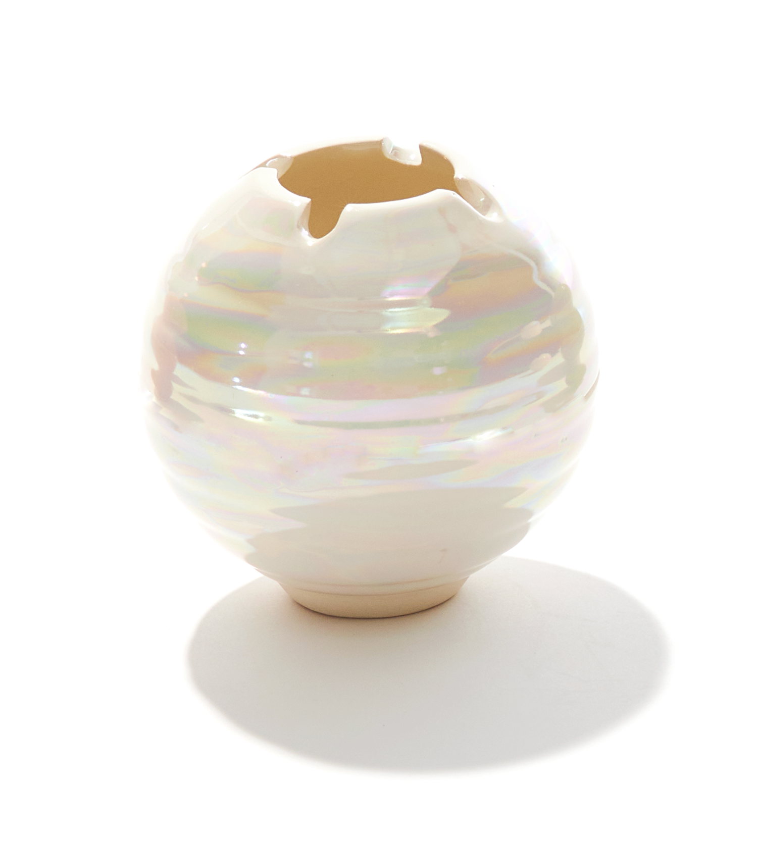 A ceramic ashtray that features a poker and a lid, this cannabis accessory is handmade by a woman-owned studio in the USA. The Orb in pearl comfortably fits in your hand and doubles as art in your home with a secure fit lid. The Orb ashtray is a discreet cannabis accessory to use while using your favorite bud products.